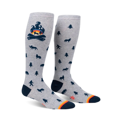 Knee-high socks in grey with a campfire and woodland creature design.  Dark blue and orange accents.