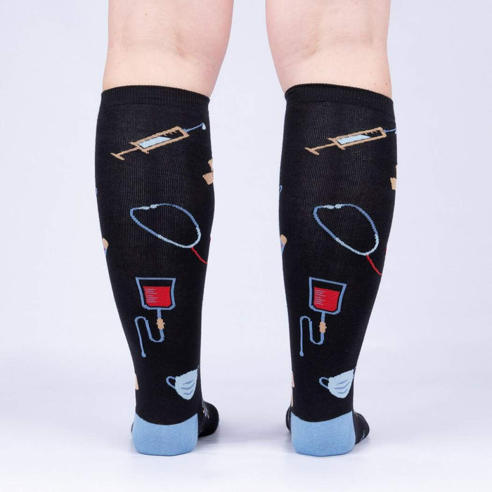 Back view of Thoracic Park socks, displaying the full design and showcasing the sock's rear print.