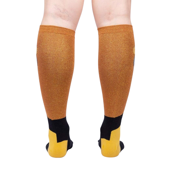 Rear view of the Crowned Crane Shimmer knee-high socks on a model's legs.