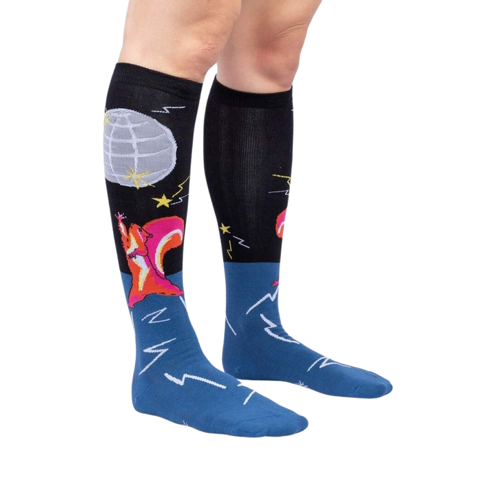 Lifestyle shot: Model wearing Disco Nut! knee-high socks, showcasing the design and fit.