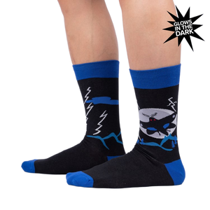 Lifestyle photo showing the socks on a person's legs, highlighting their fit and glow-in-the-dark feature.