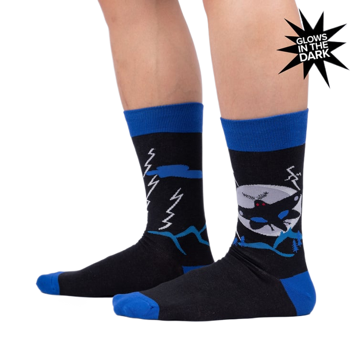 Lifestyle photo showing the socks on a person's legs, highlighting their fit and glow-in-the-dark feature.