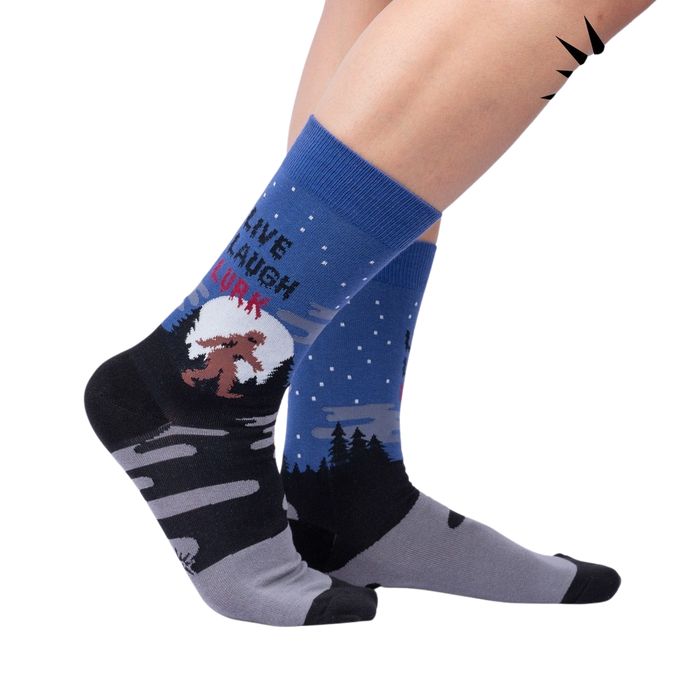 Lifestyle shot: Model wearing the 'Live, Laugh, Lurk' socks, showcasing their fit and design.