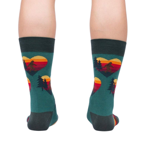 Rear view of the teal socks, showcasing the back and heel; the design is visible on the back of the socks.
