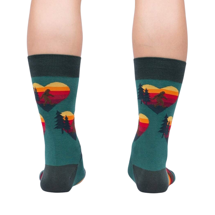 Rear view of the teal socks, showcasing the back and heel; the design is visible on the back of the socks.