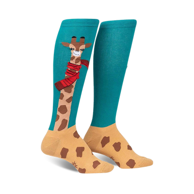 Pair of teal and tan knee-high socks featuring a whimsical giraffe design wearing a red scarf.