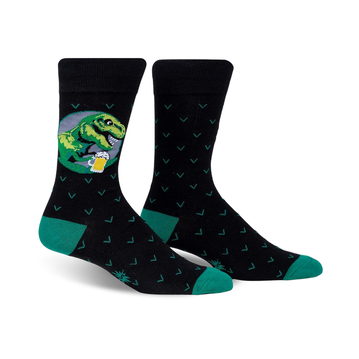 Pair of black crew socks with teal accents. One sock features a graphic of a T-Rex drinking beer in a circular design. }}