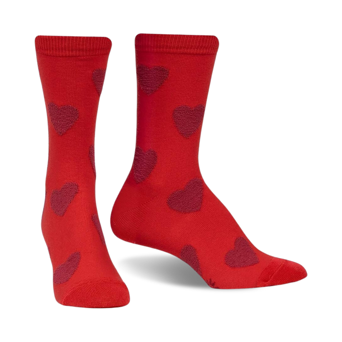 womens crew socks in red with a pattern of dark pink hearts, perfect for valentine's day.  