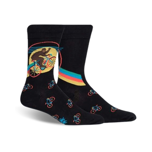 Pair of black crew socks featuring a Bigfoot riding a bike graphic. Smaller bike designs are repeated on the sock.