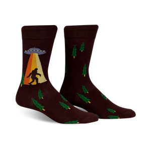 Brown crew socks featuring a Bigfoot sighting, UFO, and green trees.  Fun, quirky design.