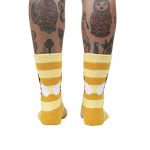 Back view of the Bee Cozy Slipper Socks on a person's legs.