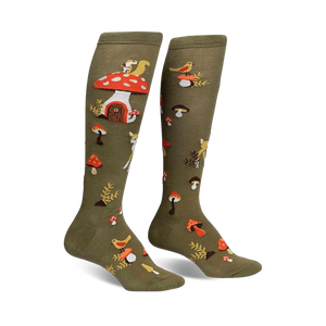 Pair of olive green knee-high socks with whimsical mushroom houses, squirrels, deer, and birds.  A charming forest design.