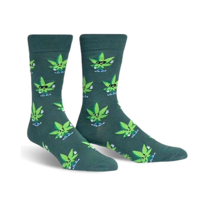 Pair of crew socks in dark teal with a pattern of cartoon marijuana leaves wearing sunglasses and giving peace signs. }}