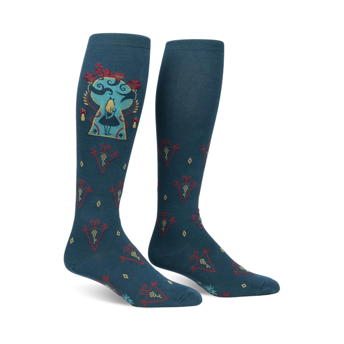 Pair of teal knee-high socks with an Alice in Wonderland design. The main image shows Alice in a keyhole, surrounded by keys and other whimsical elements. }}