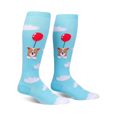 Pair of light blue knee-high socks. Features a cute corgi dog attached to a red balloon floating amongst white clouds.