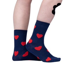 A dark blue sock with two red hearts.