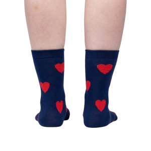 A dark blue sock with two red hearts.