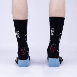 Back view of the Thoracic Park socks on a model's legs, highlighting the design details on the back of the socks.