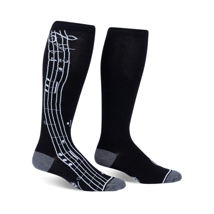 black knee-high socks with a white treble clef and notes, for men and women, knee high calf wide.   