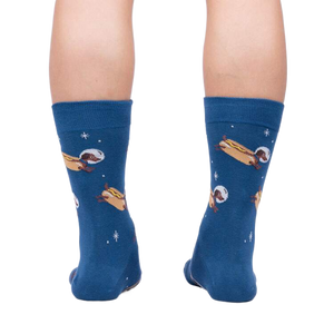Rear view of the 'Weiner Dogs, In Space!' socks on a person's legs.