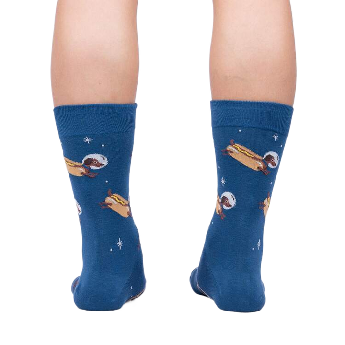 Rear view of the 'Weiner Dogs, In Space!' socks on a person's legs.
