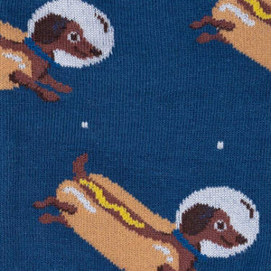 Close-up detail shot of the sock fabric, highlighting the whimsical dachshund astronaut design.