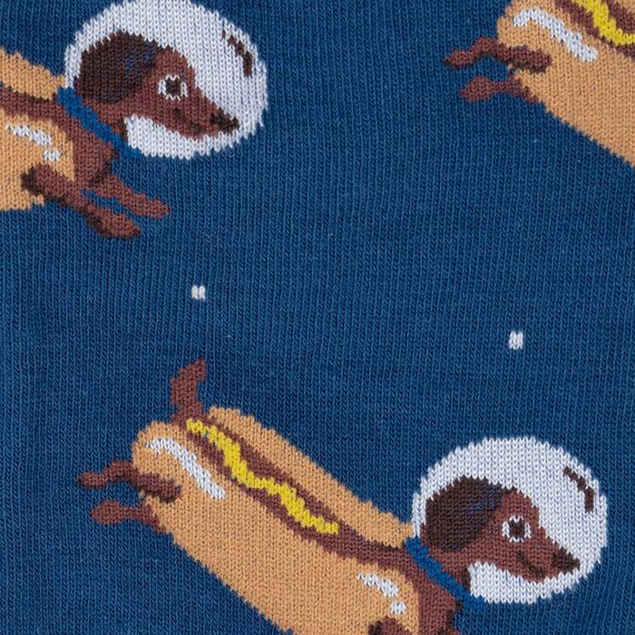 Close-up detail shot of the sock fabric, highlighting the whimsical dachshund astronaut design.