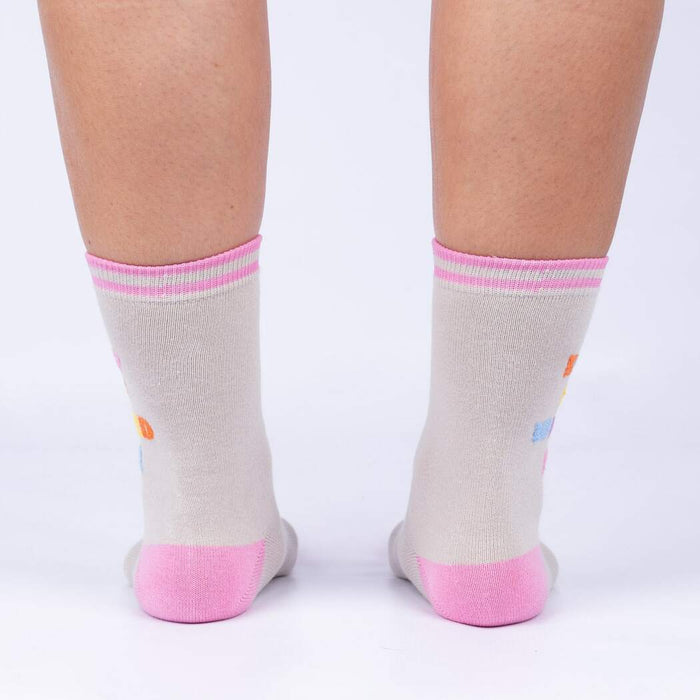 A pair of gray socks with pink toes, heels, and??Ñ?üì?Åú. There is a colorful pattern of ice cream cones on the socks.