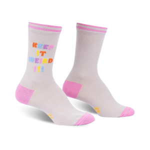 Pair of grey crew socks with a multicolored 'Keep It Weird!' text design and pink cuffs.