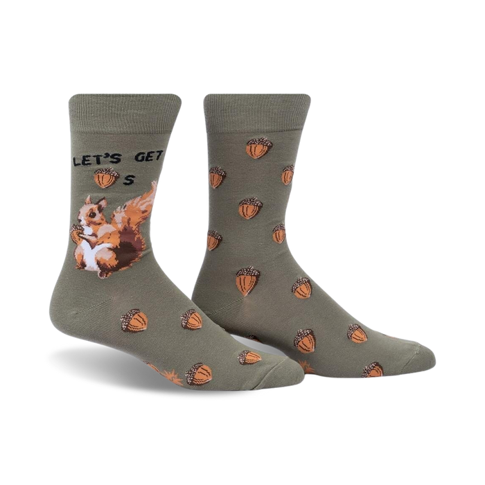 Crew socks in olive green with acorns and a squirrel design.  The text 'Let's Get Nuts' is featured on the sock.
