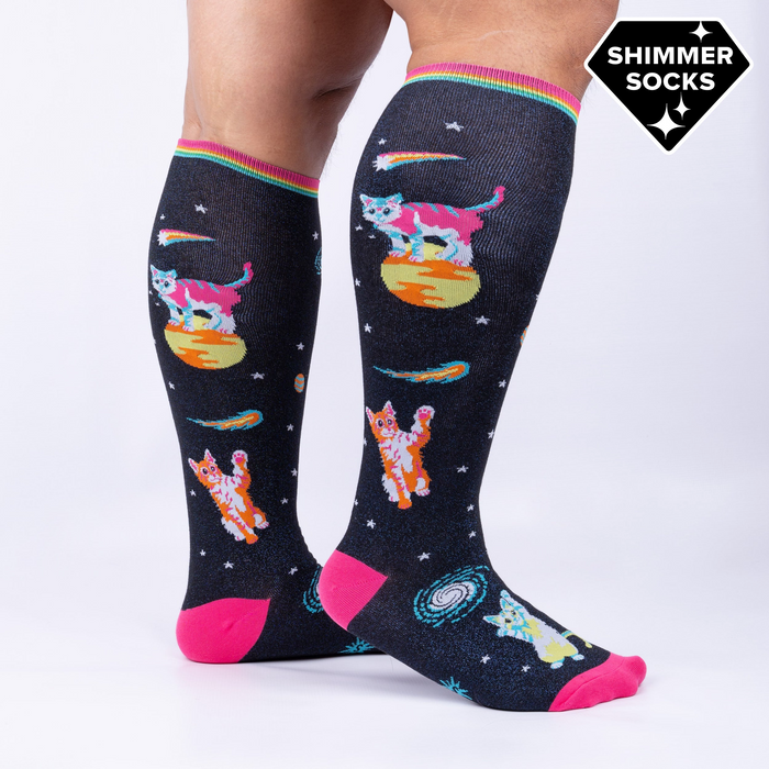 Model wearing Space Cat knee-high socks.  Shows the socks from the side, highlighting their length and design.