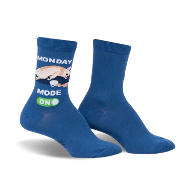 Pair of blue crew socks featuring a cream chihuahua graphic and 'Monday Mode: On' text. Fun, casual style.