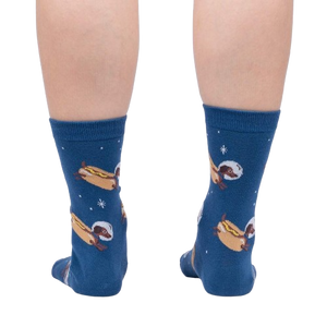 Back view of a person wearing the Weiner Dogs, In Space! Glow in the Dark socks.  Shows full sock pattern on both legs.