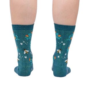 Rear view of the socks on a person's legs, displaying the design from the back.