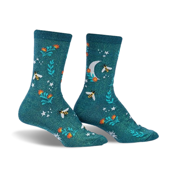 Pair of teal crew socks featuring a whimsical pattern of bees, flowers, a crescent moon, and stars.