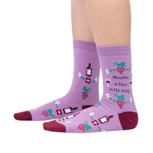 Lifestyle photo showcasing the 'Maybe Wine Will Help' socks on a person's legs.