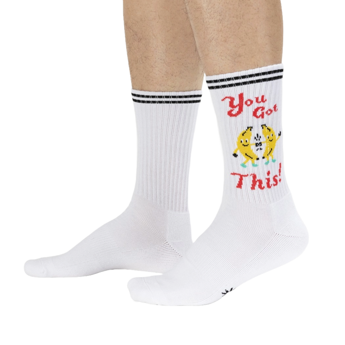 Lifestyle shot of a person wearing the 'You Got This!' socks, showcasing how they look on feet.