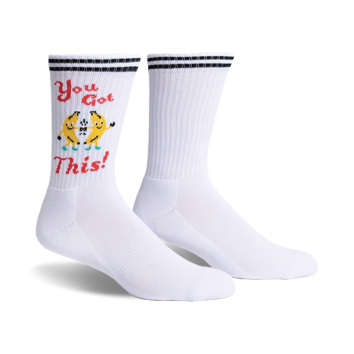 White crew socks with black stripes and a fun graphic of two dancing bananas that say 'You Got This!'