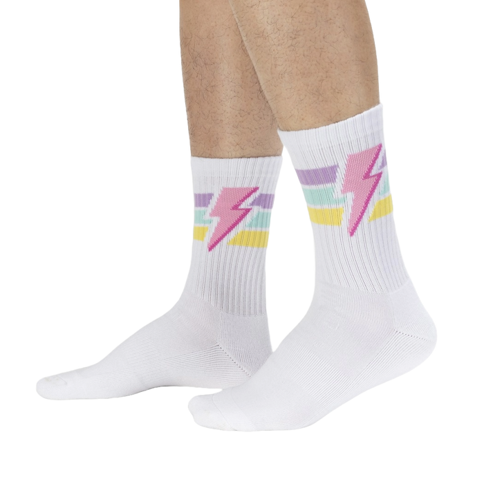 Lifestyle shot of male model wearing white Thunderstruck socks.