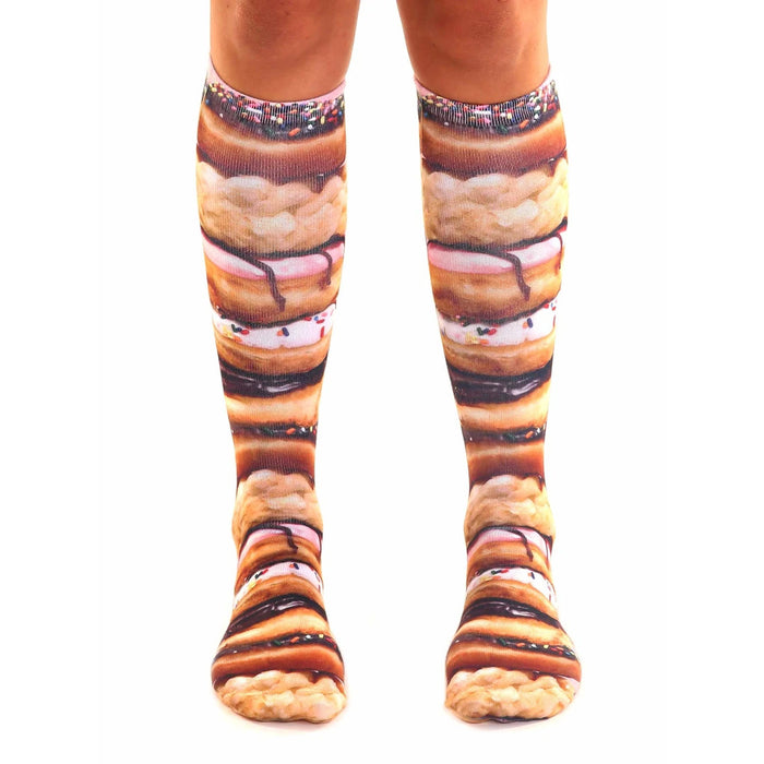 pink, brown, white stacked donut pattern, icing, sprinkles, and chocolate frosting on high socks for men and women.  