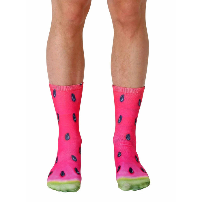 Pair of crew socks with a vibrant watermelon slice print.  Red, pink, black, and green colors are featured.