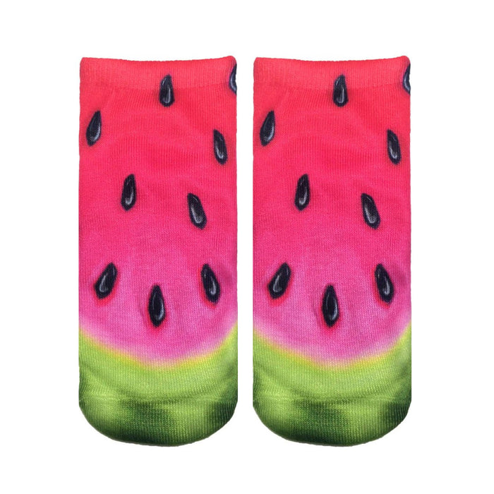 Pair of ankle socks with a realistic watermelon print.  Red, pink, green, and black colors create a juicy watermelon design. }}