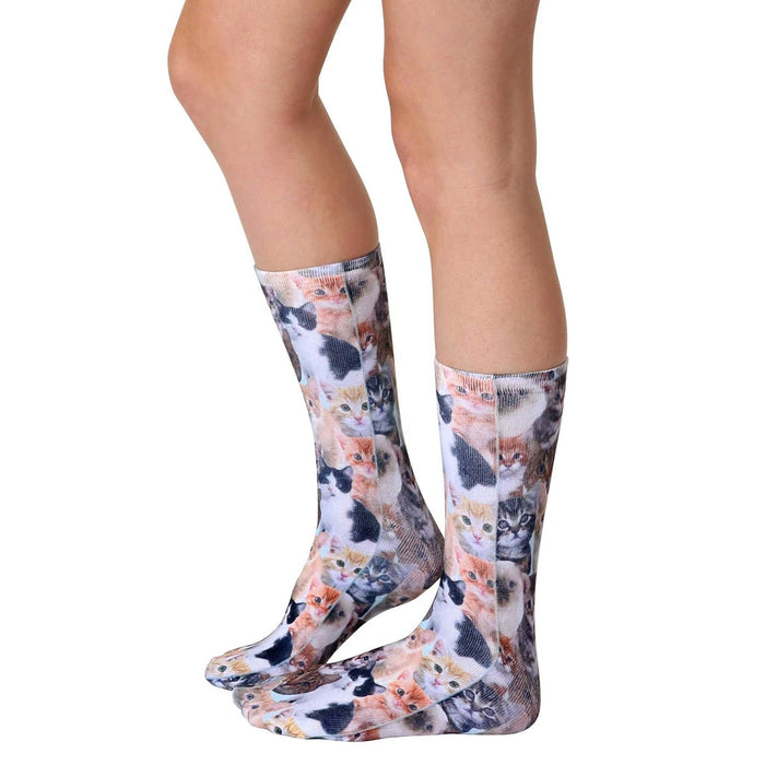 Lifestyle photo showcasing 'Kitty All Over' socks on a person's legs, highlighting the sock's fit and design.