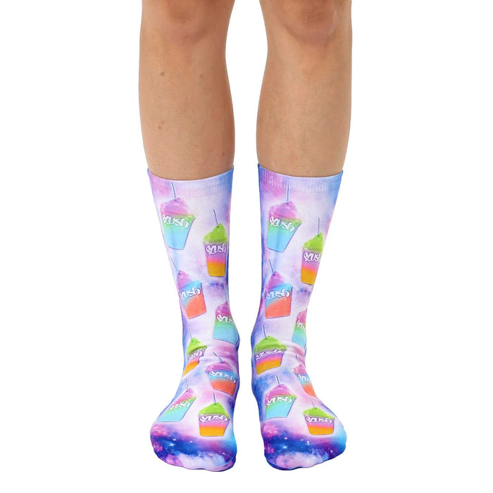 Pair of crew socks with a vibrant design of colorful slushies on a galaxy-print background. The slushies are pink, green, and orange.