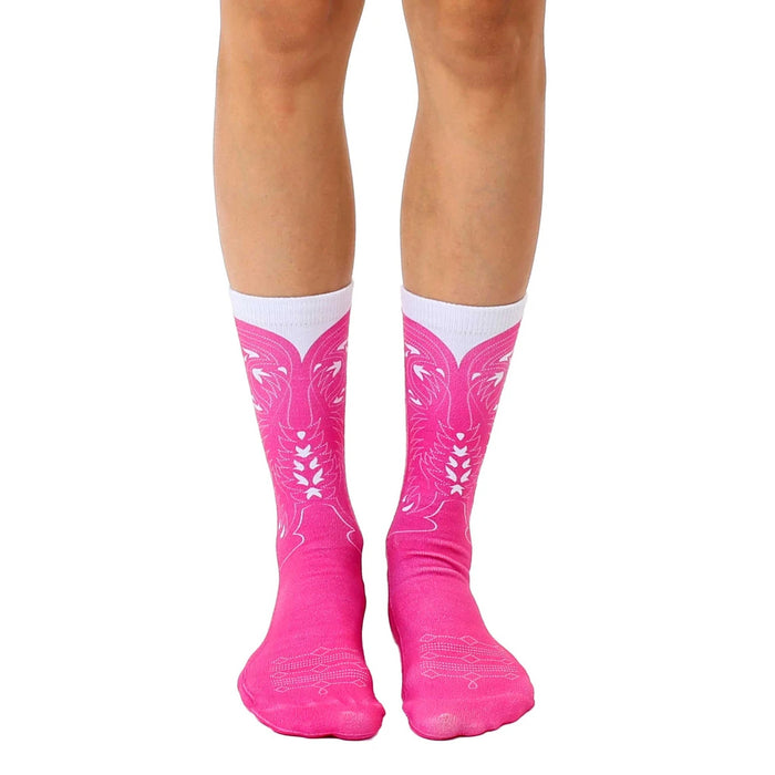 Pair of pink crew socks with a white cowboy boot design.  Fun and stylish!