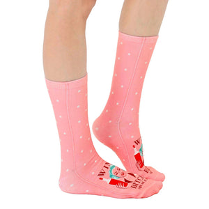 Lifestyle shot of the 'Sassy Wine' socks on a model's feet, showcasing the sock's fit and design.