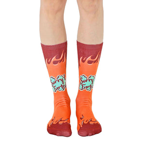 A pair of orange crew socks with maroon flames and 'Sorry I Farted' text in teal. Fun and comfortable!