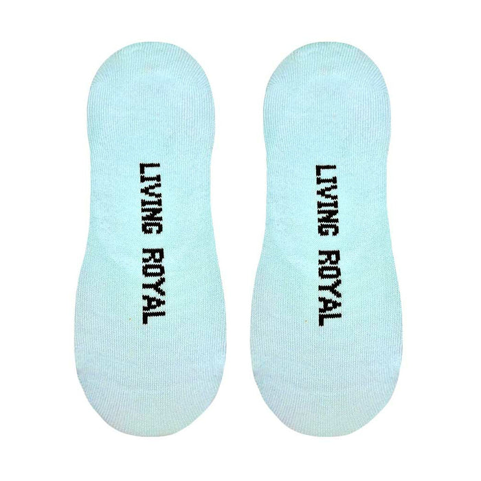 A pair of mint green no-show socks with a rainbow and clouds design and the words 