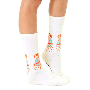 Lifestyle shot of a person modeling the 'F*ck Politeness' socks, showcasing how they look when worn.