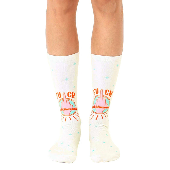 Cream-colored crew socks featuring a repeated design of a middle finger with 'F*ck Politeness' in orange and teal.